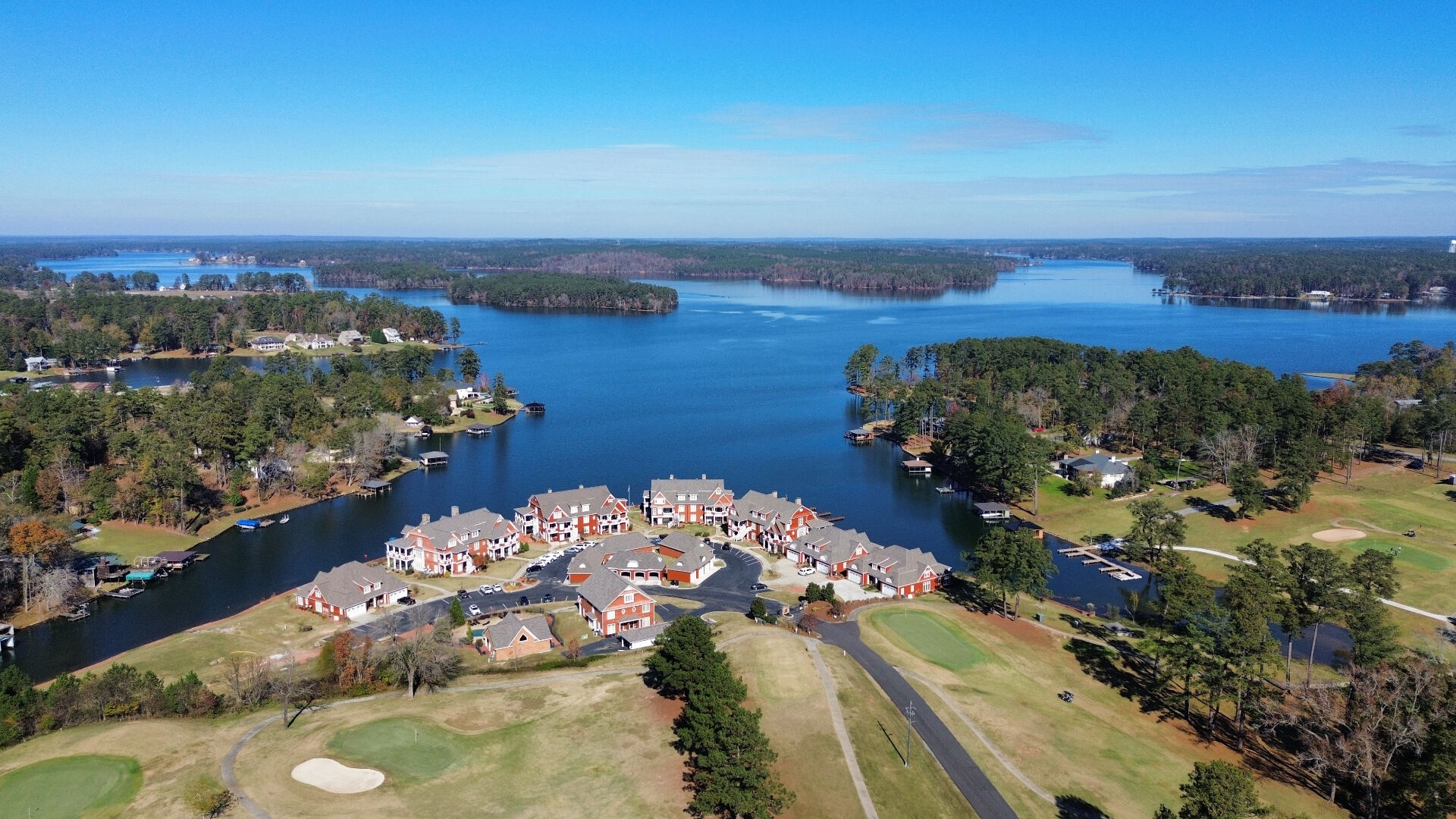 Clubhouse, golf course, and marina — a golf-cart ride away.