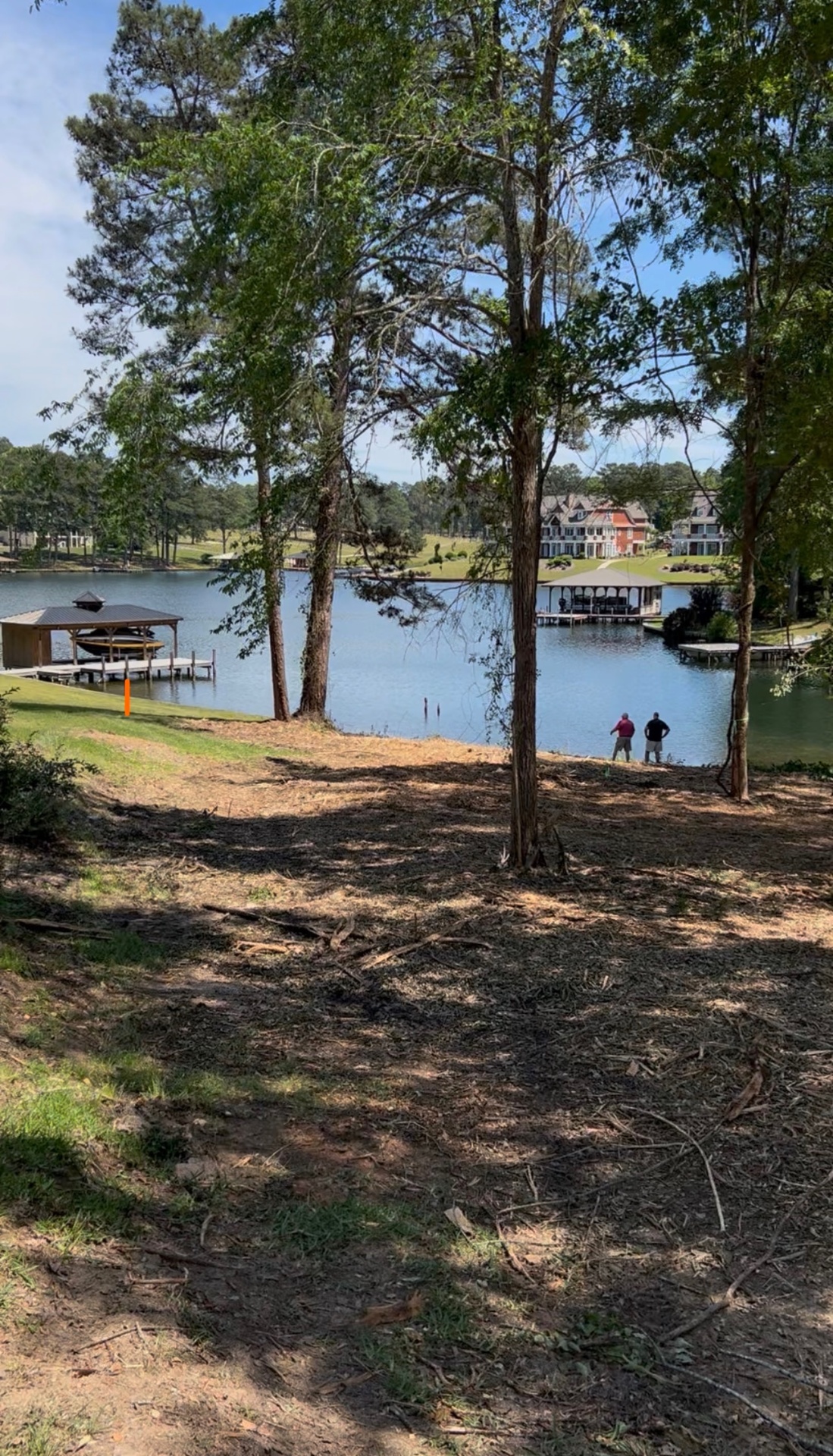 From the homesite — open water, the country club, and the cove beyond.